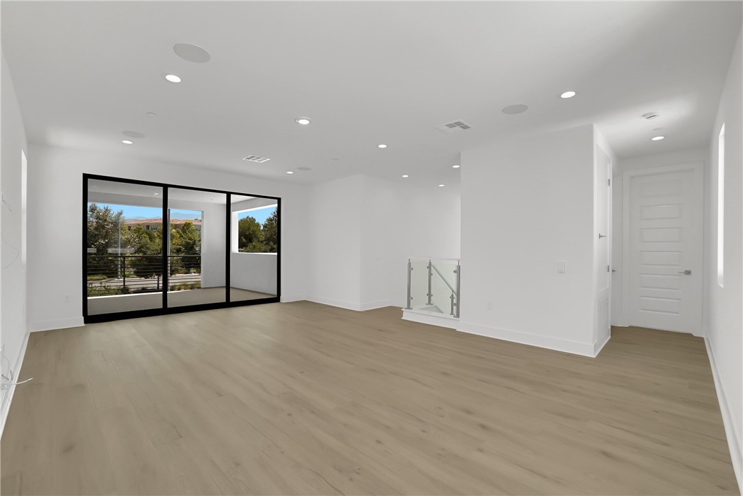 168 Creation Irvine, CA 92618 - Photo 44 of 59 a view of an empty room with a sliding door