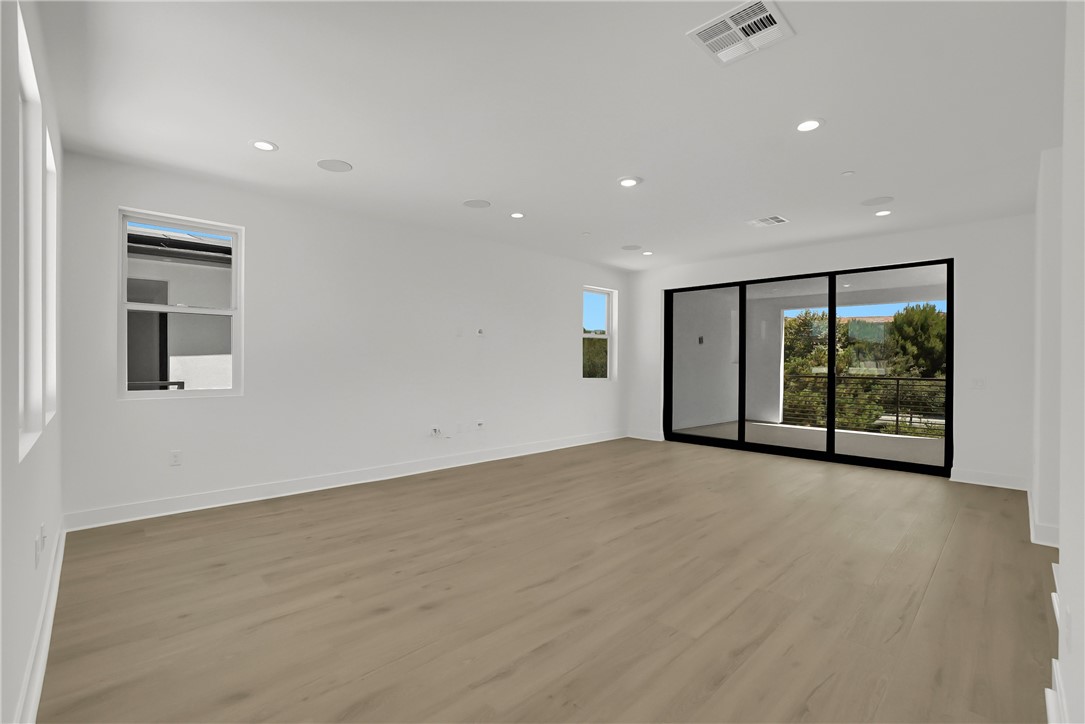 168 Creation Irvine, CA 92618 - Photo 47 of 59 wooden floor in an empty room with a window