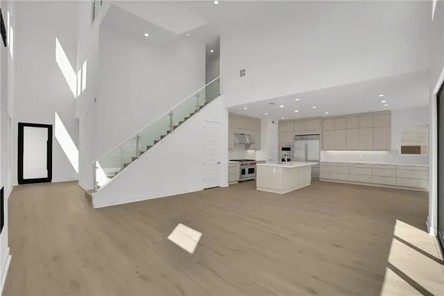 a view of a kitchen with furniture and stairs