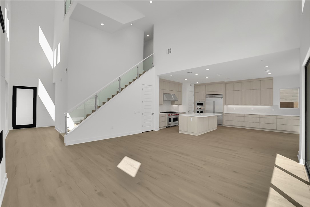 168 Creation Irvine, CA 92618 - Photo 9 of 59 a view of a kitchen with furniture and stairs