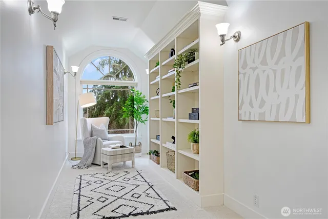 a view of living room with furniture and a large window