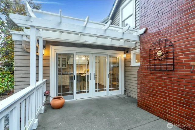 a view of a patio with table and chairs and potted plants