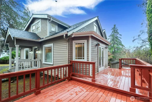a view of a wooden deck with a yard