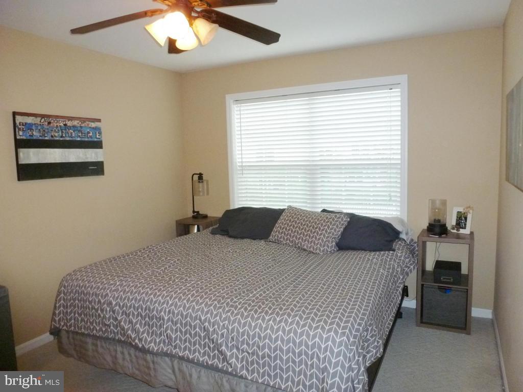600 Chatham Way Lititz, PA 17543 - Photo 11 of 26 a bedroom with a bed and a chandelier