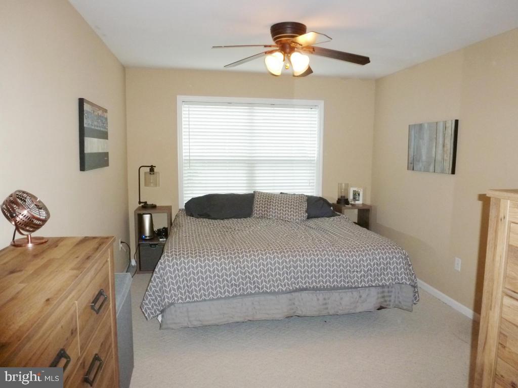 600 Chatham Way Lititz, PA 17543 - Photo 12 of 26 a bedroom with a bed and a chandelier