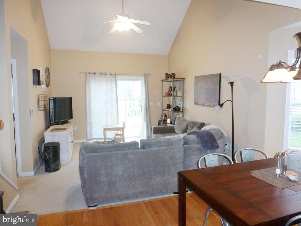 600 Chatham Way Lititz, PA 17543 - Photo 4 of 26 a living room with furniture a flat screen tv and a large window