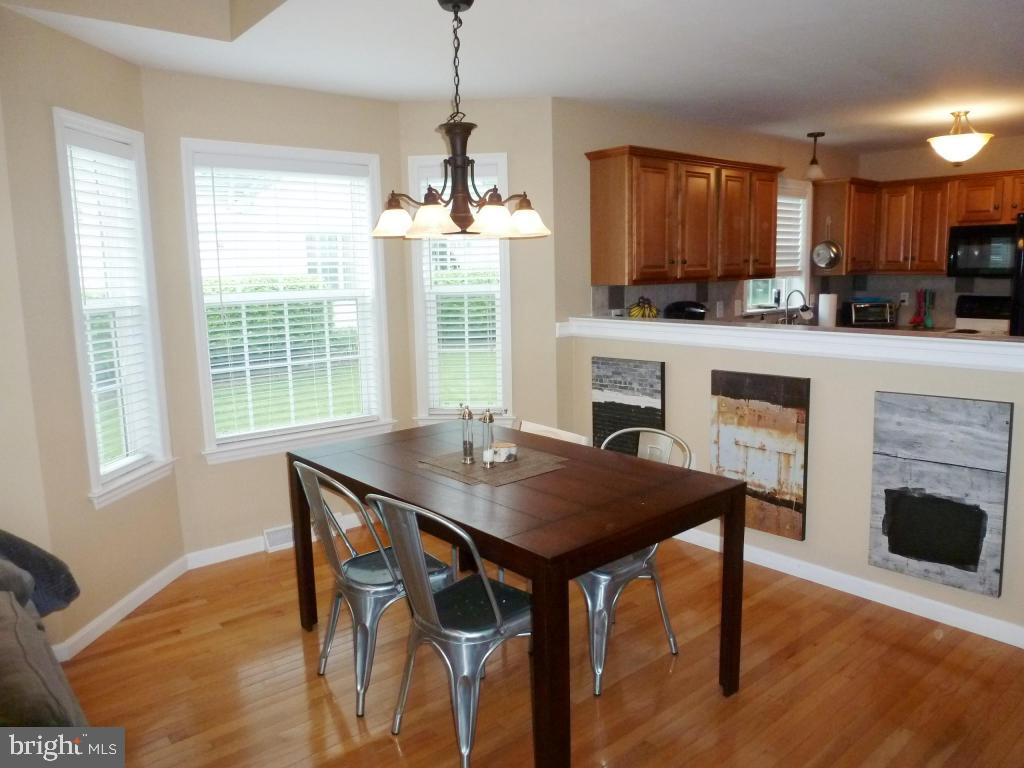 600 Chatham Way Lititz, PA 17543 - Photo 5 of 26 a view of a dining room with furniture window and wooden floor