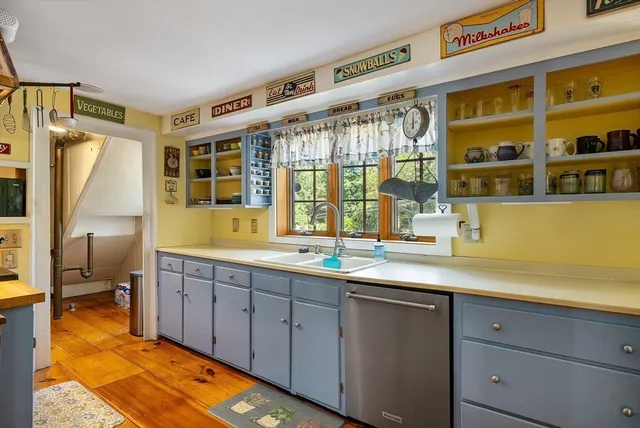 a spacious bathroom with a double vanity sink and a large mirror
