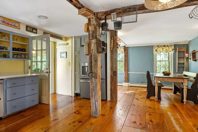 a view of a livingroom with furniture window and wooden floor