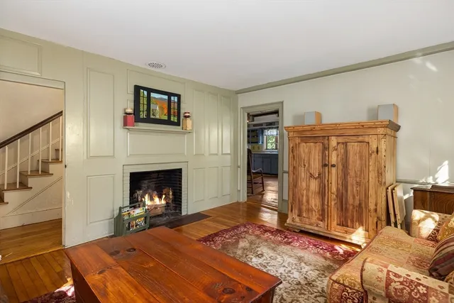 a bedroom with a bed and a fireplace