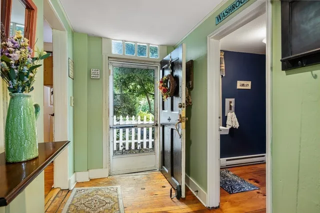 a bedroom with a sink and a mirror