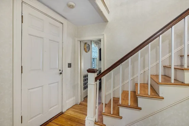 a bedroom with a bed and a television