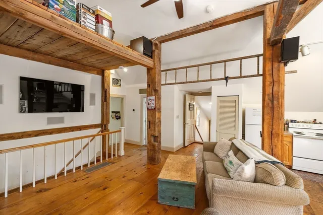 a kitchen with sink cabinets and wooden floor