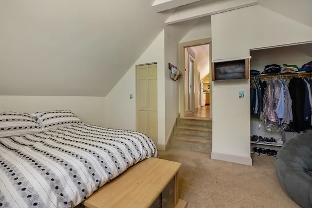 a view of a house with backyard sitting area and garden