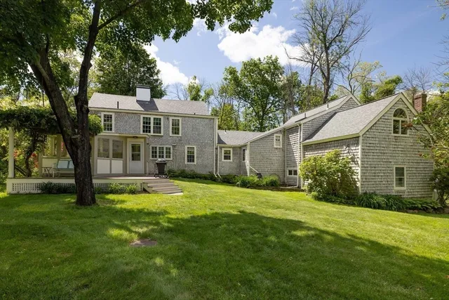 a front view of house with yard and green space