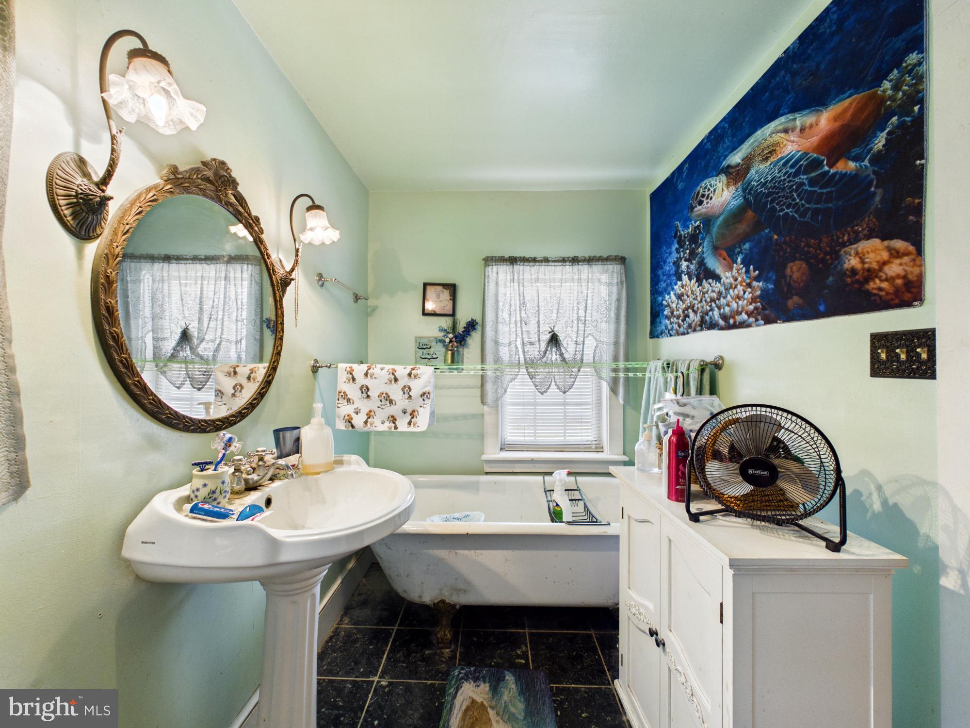 20488 Nanticoke Road Nanticoke, MD 21840 - Photo 18 of 32 Serene bathroom with oceanic vibes.