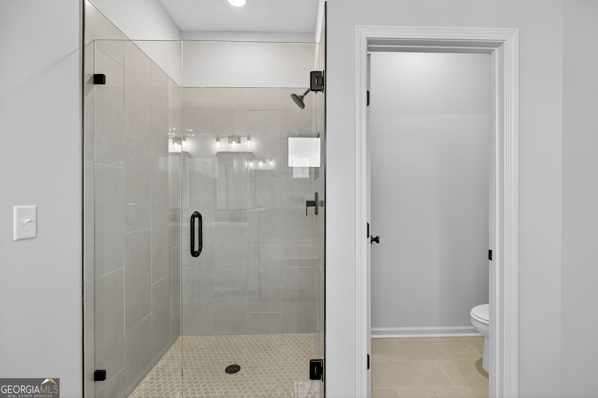 359 Gray Road Roopville, GA 30170 - Photo 31 of 46 a bathroom with a shower and a glass door