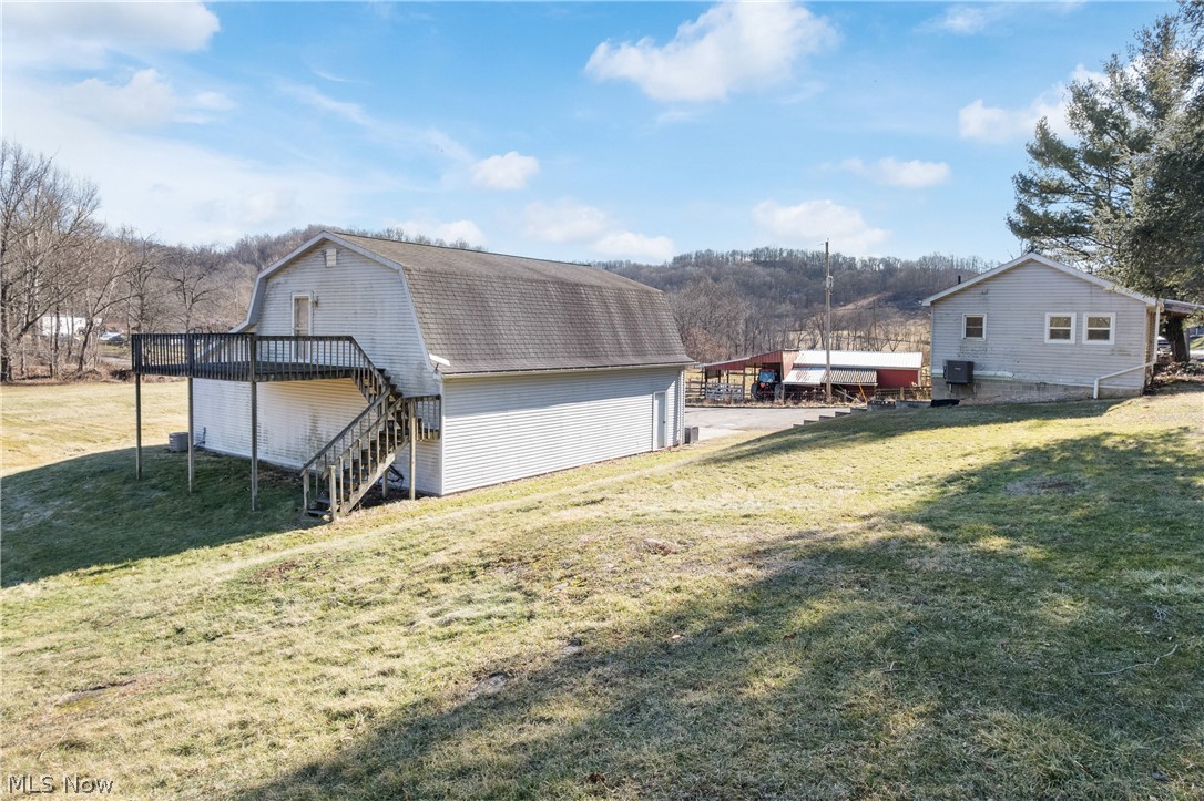 29395 Beitler Road Dennison, OH 44621 - Photo 12 of 33 View of outdoor structure featuring stairs and walkout balcony