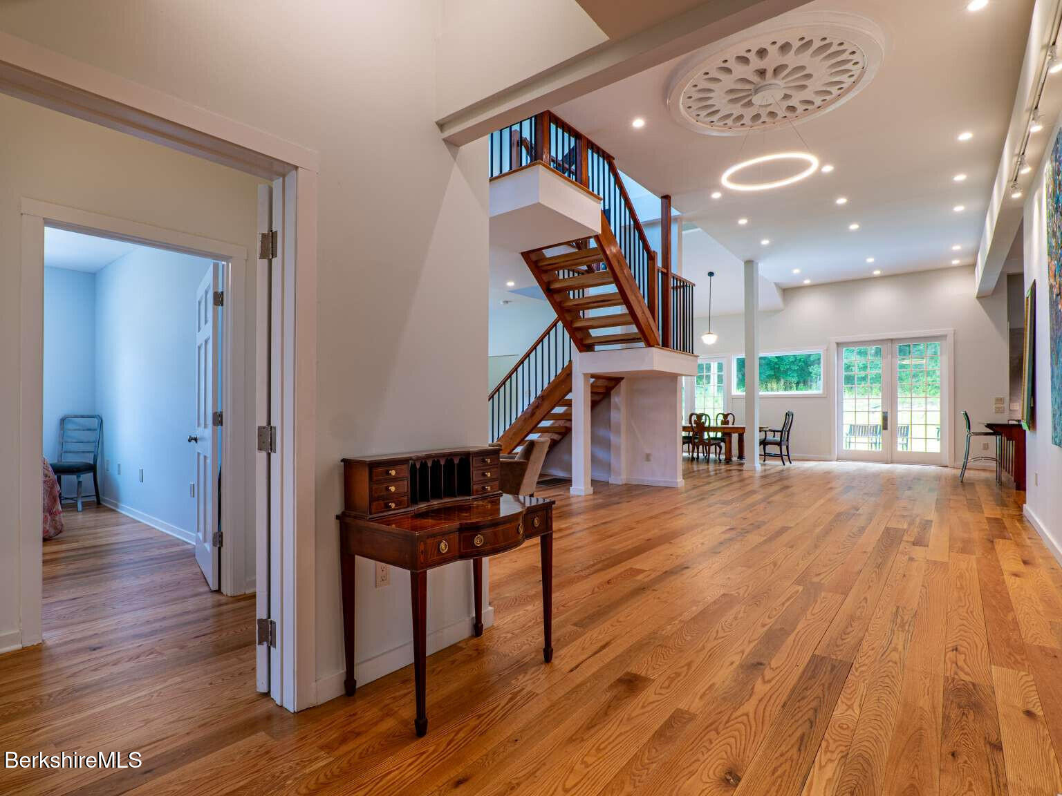 160 High Street Lee, MA 01238 - Photo 11 of 41 a view of a hallway with wooden floor and staircase