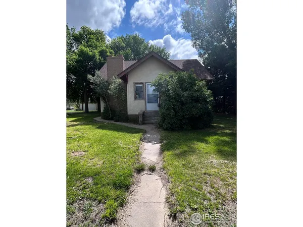 a house view with a garden space