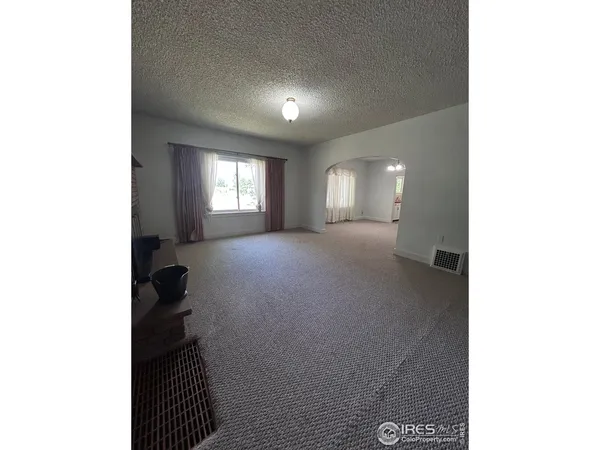 a view of a hallway with windows