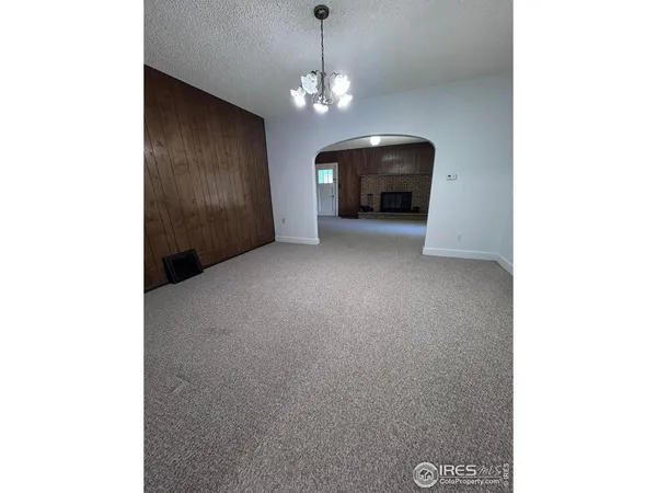 a view of a windows and chandelier in a room