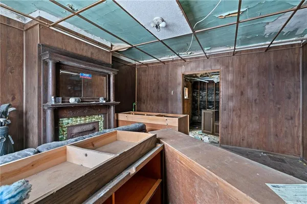 a kitchen with a sink and wooden floor