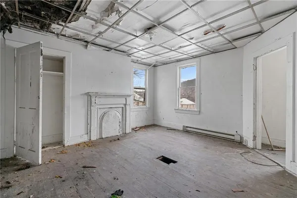 a view of livingroom with hardwood floor and hallway