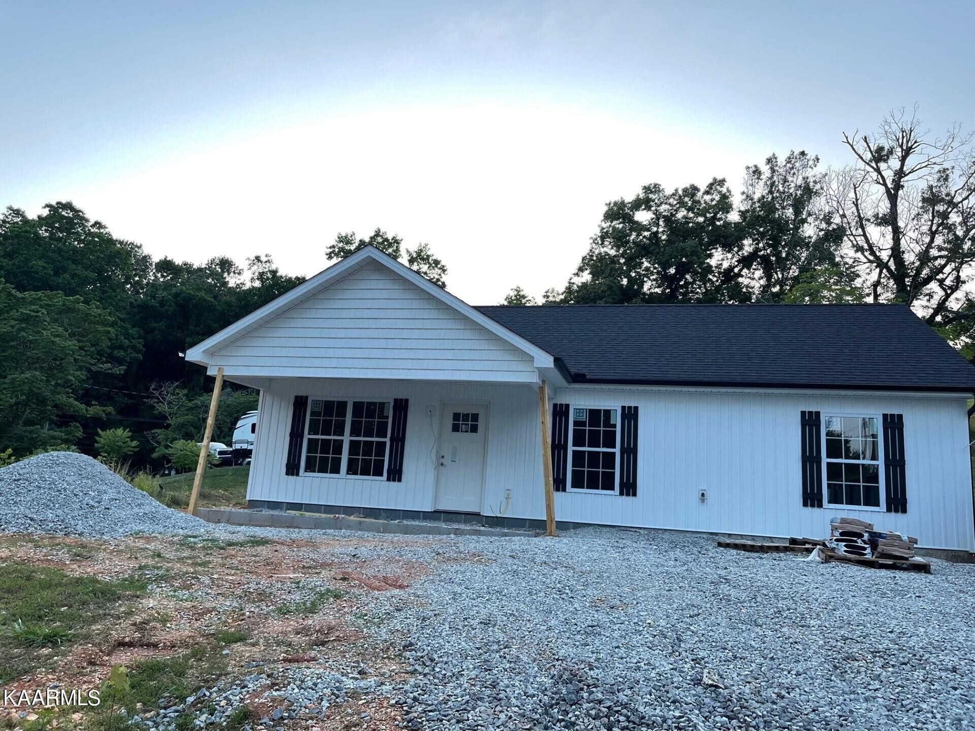 206 Hickory Street Clinton, TN 37716 - Photo 1 of 6 a house with trees in the background