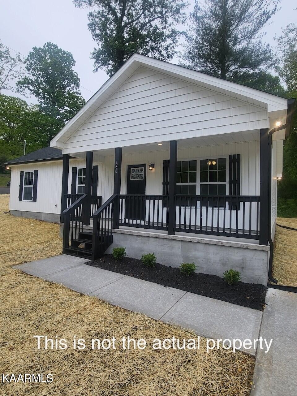 206 Hickory Street Clinton, TN 37716 - Photo 3 of 6 a view of a house with a patio