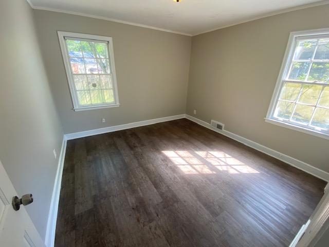 4128 Michael Road Memphis, TN 38116 - Photo 3 of 11 an empty room with wooden floor and windows