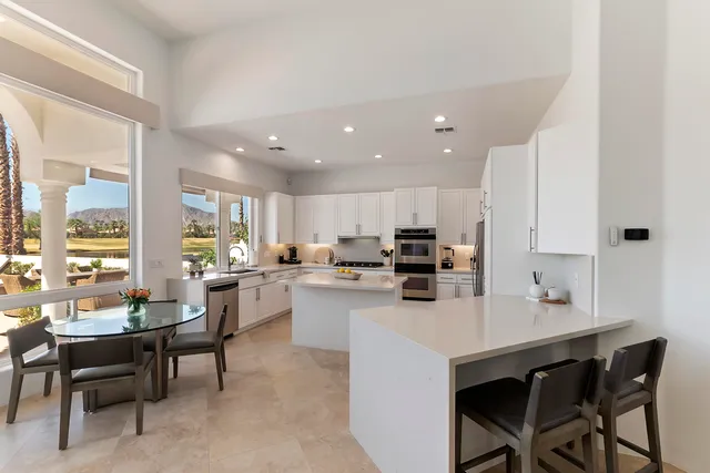a kitchen with a sink a counter top space and appliances
