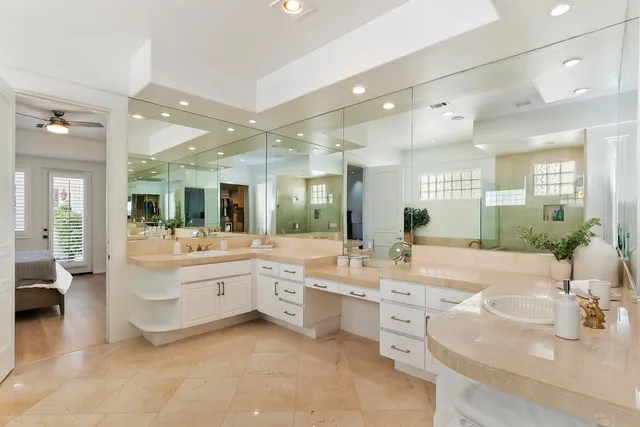a large bathroom with a large tub and sink