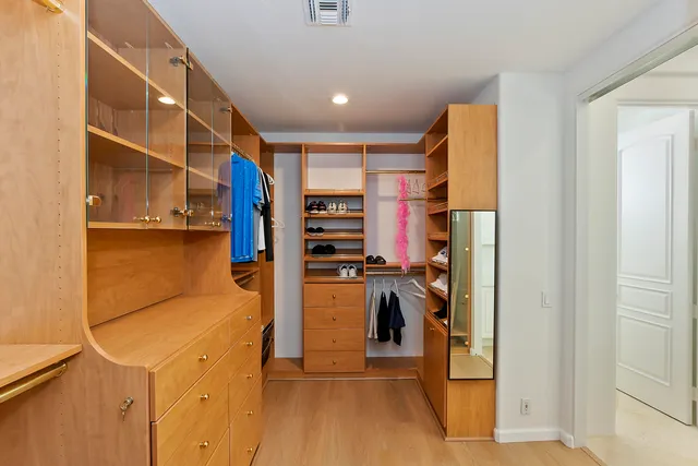 a view of a kitchen with refrigerator and a stove