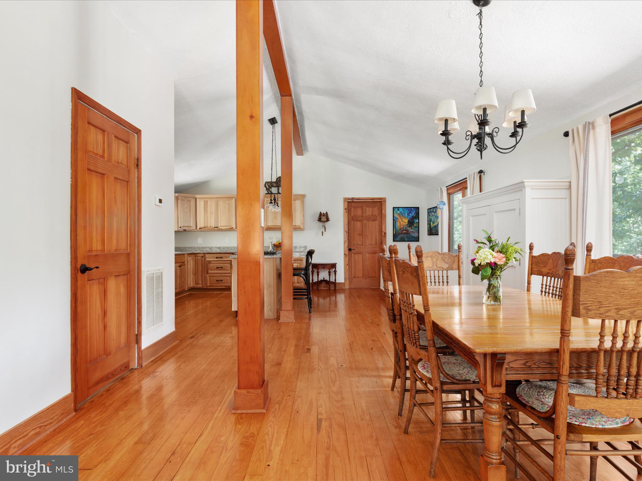 4327 Ebenezer Road Bluemont, VA 20135 - Photo 12 of 93 a view of a dining room and livingroom with furniture wooden floor a chandelier