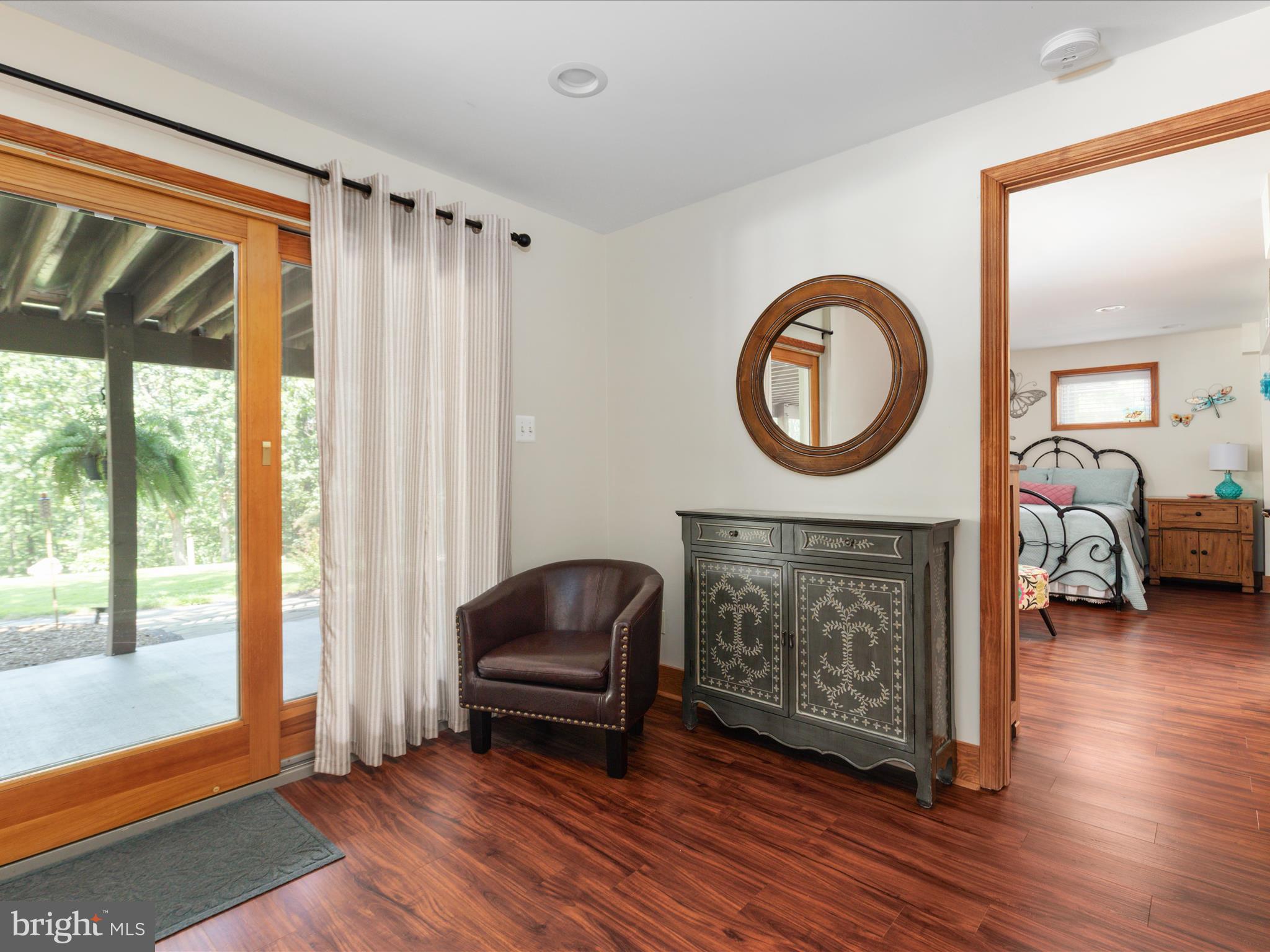 4327 Ebenezer Road Bluemont, VA 20135 - Photo 24 of 93 a living room with furniture a window and a fireplace
