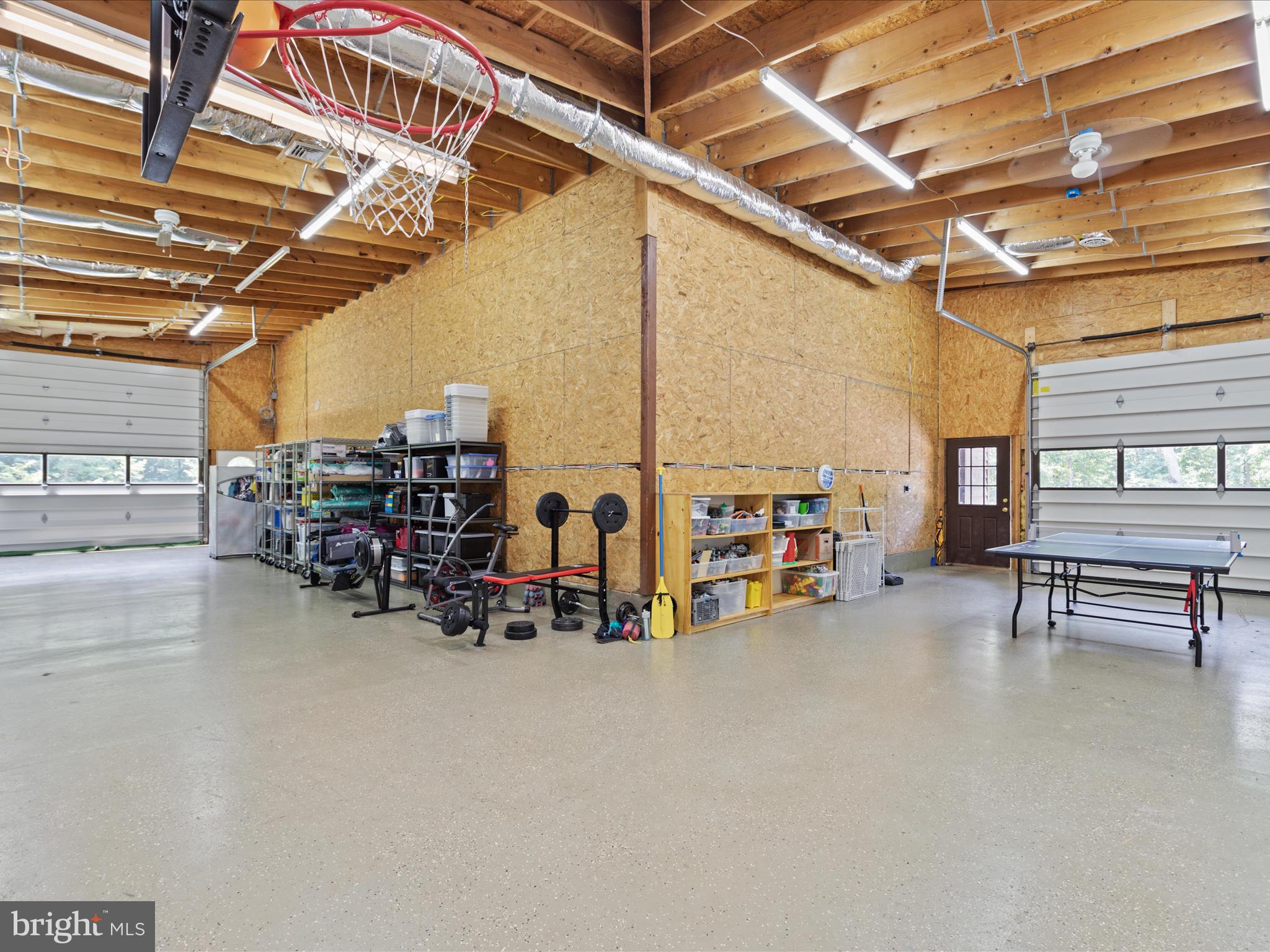 4327 Ebenezer Road Bluemont, VA 20135 - Photo 38 of 93 a view of a empty room with furniture and a garage