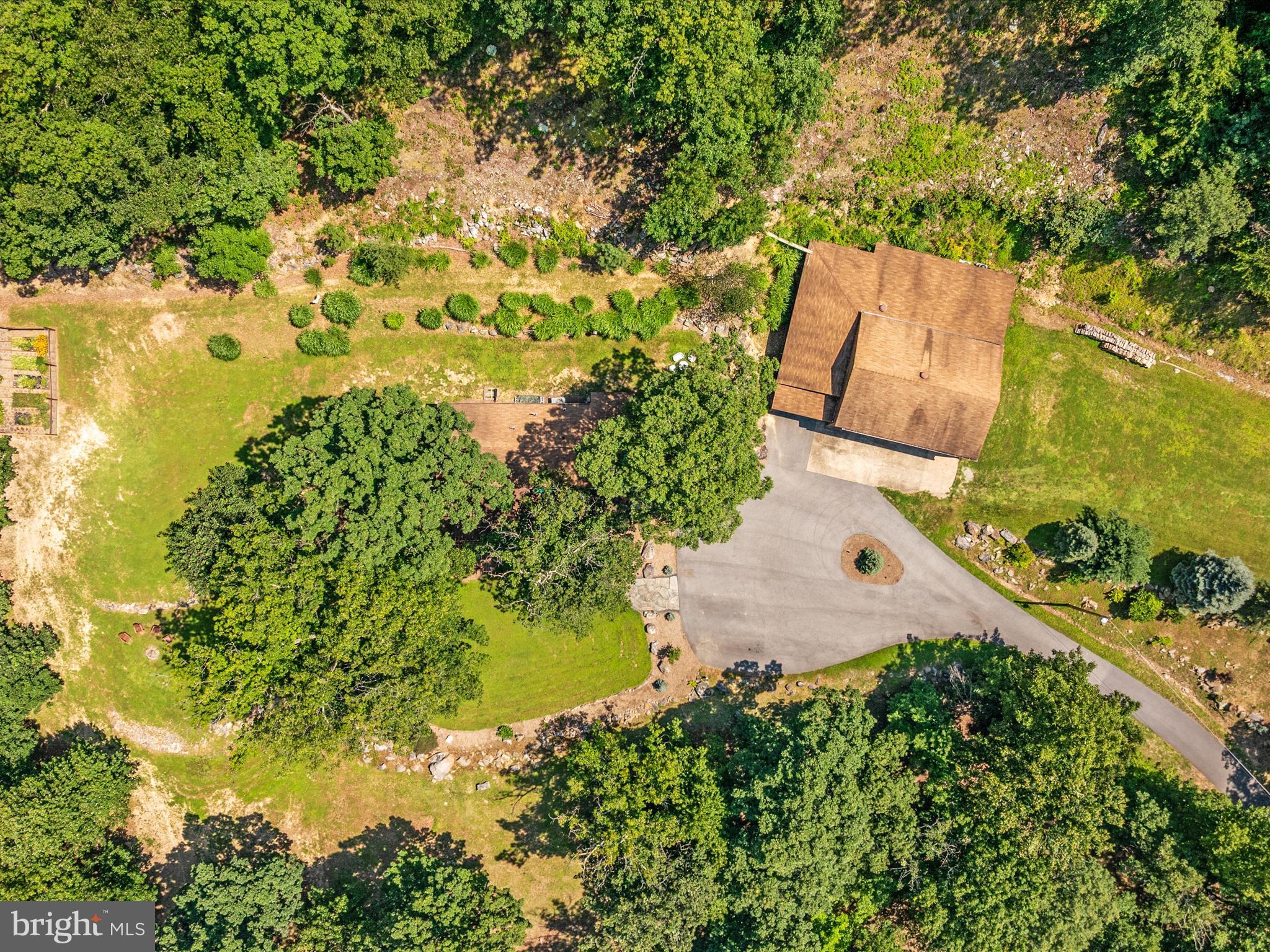 4327 Ebenezer Road Bluemont, VA 20135 - Photo 80 of 93 an aerial view of a house with a yard lake and trees all around