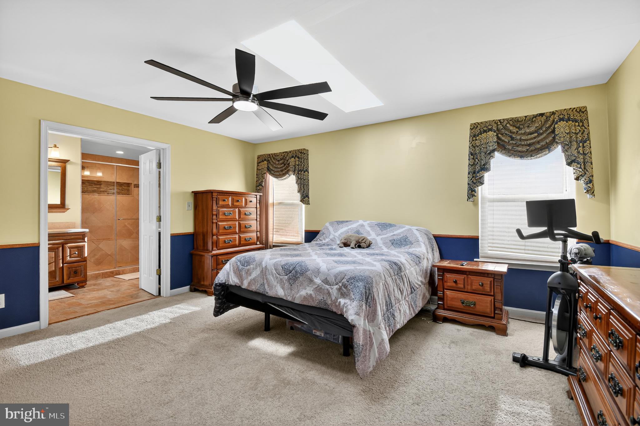 22040 Caravel Court Great Mills, MD 20634 - Photo 12 of 32 a bedroom with a bed and a chandelier