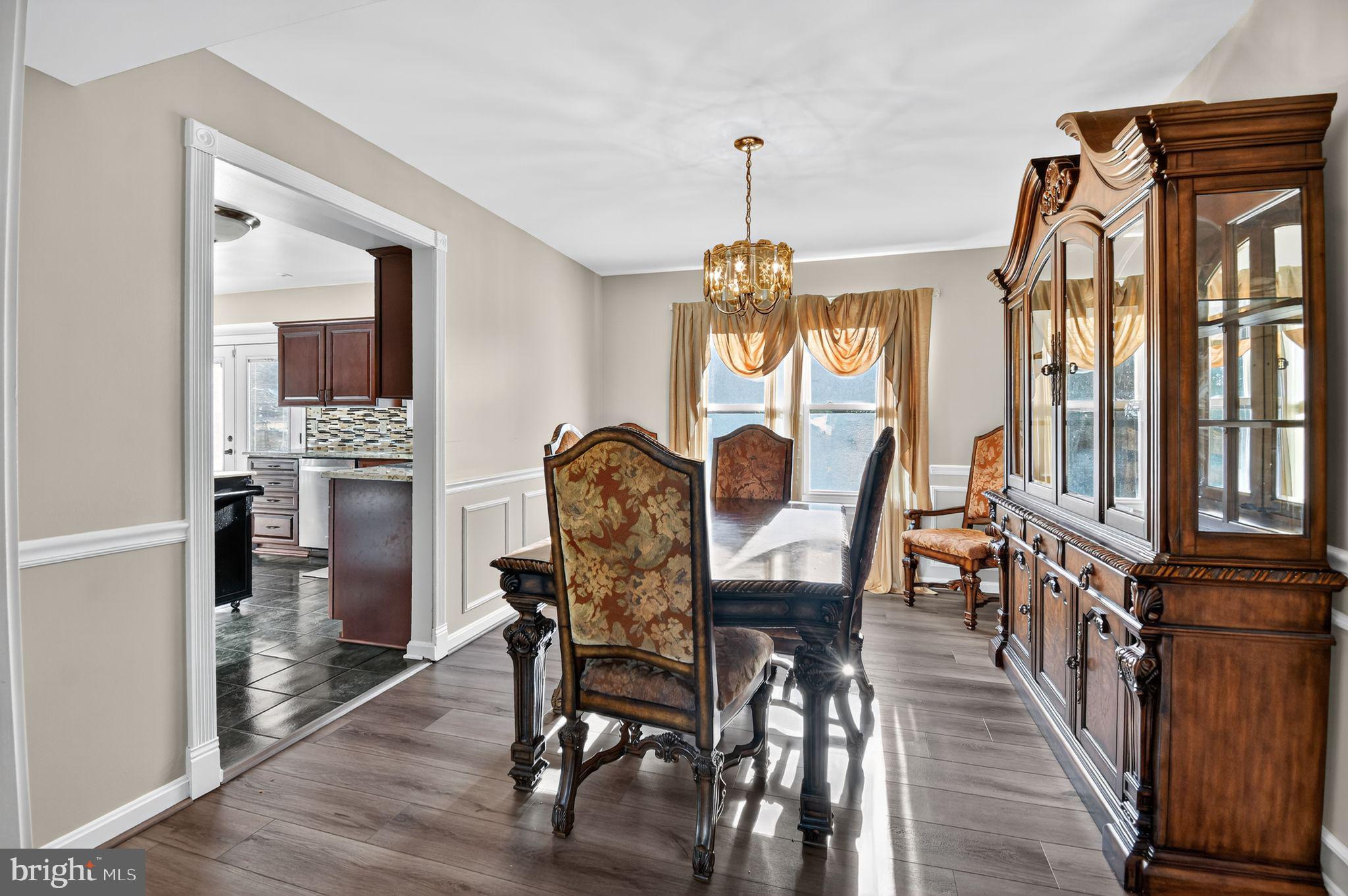 22040 Caravel Court Great Mills, MD 20634 - Photo 15 of 32 a view of a dining room with furniture window and wooden floor