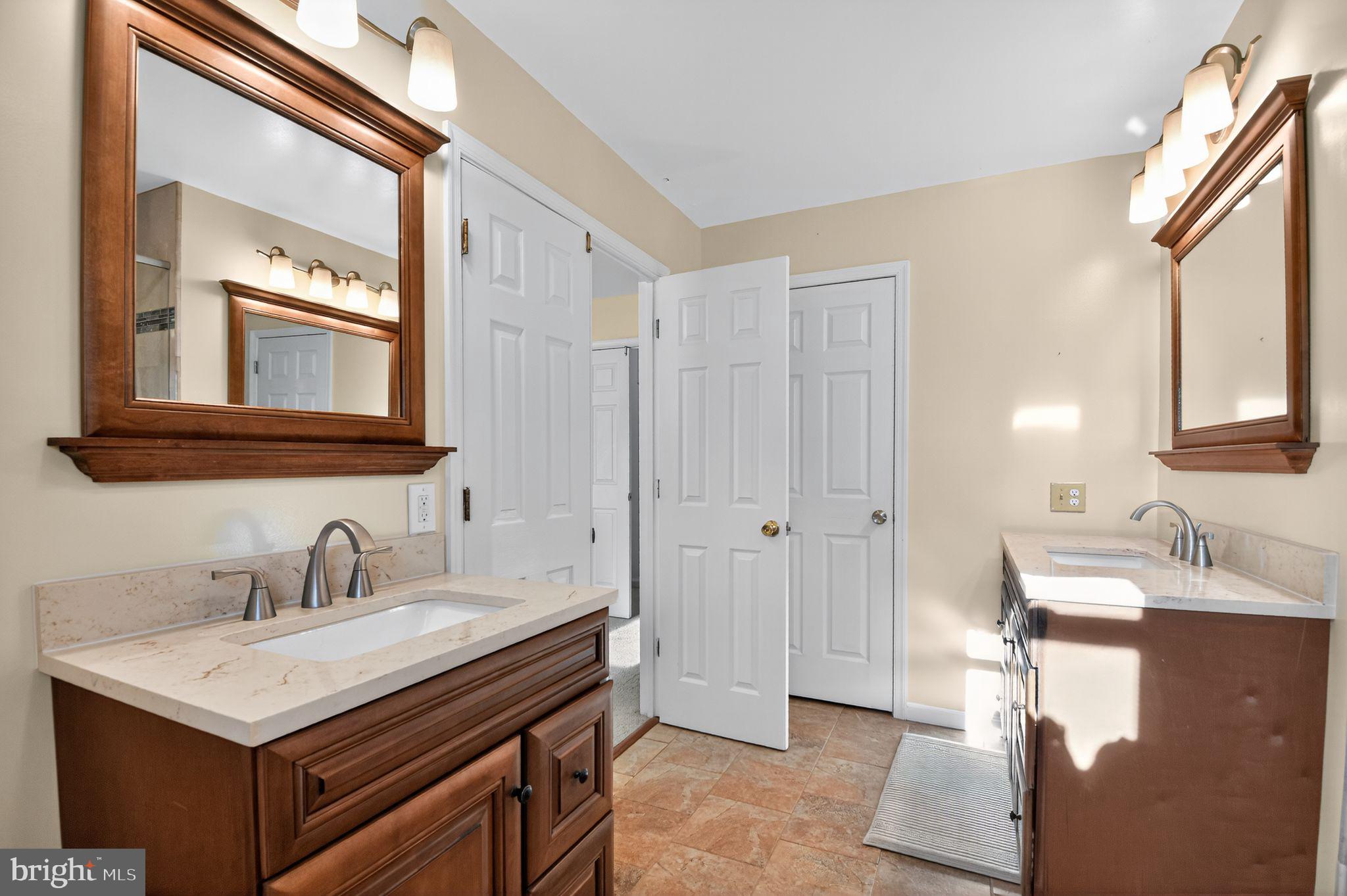 22040 Caravel Court Great Mills, MD 20634 - Photo 25 of 32 a bathroom with a sink and a mirror