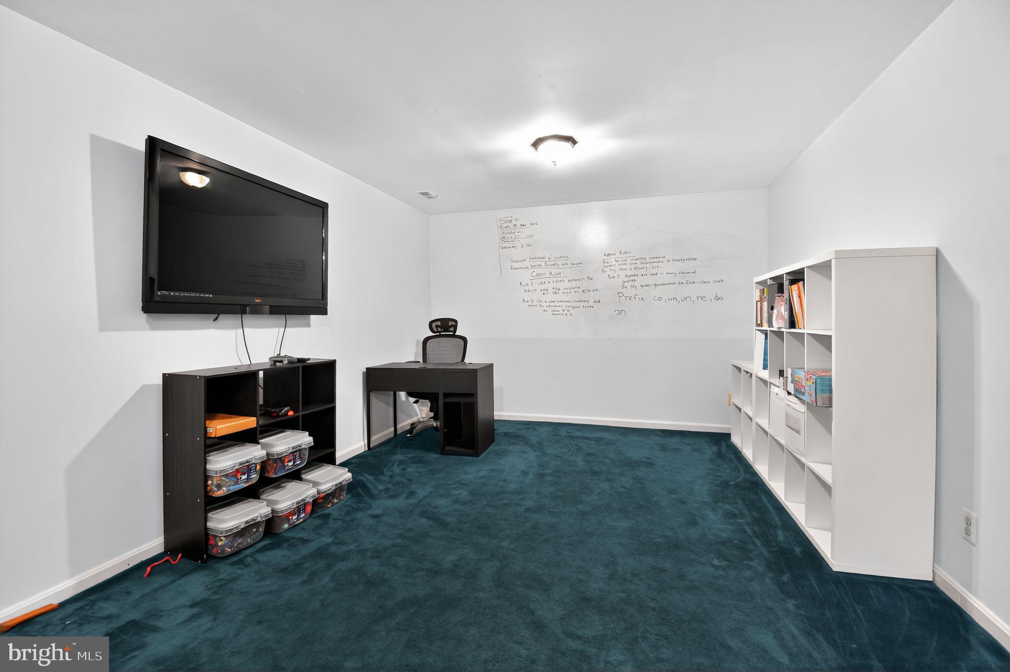 22040 Caravel Court Great Mills, MD 20634 - Photo 28 of 32 a living room with furniture and a flat screen tv