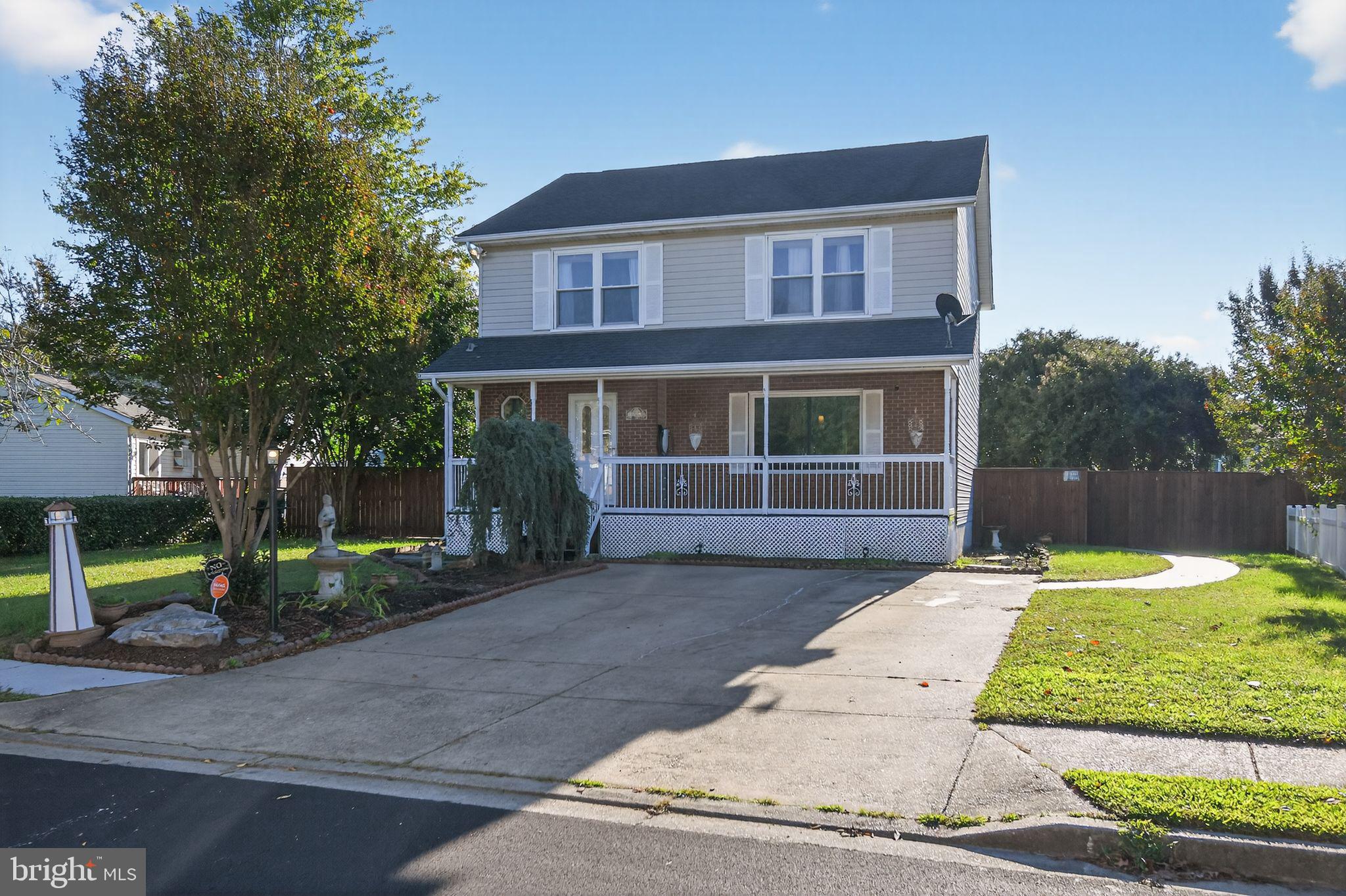 22040 Caravel Court Great Mills, MD 20634 - Photo 32 of 32 a front view of a house with garden