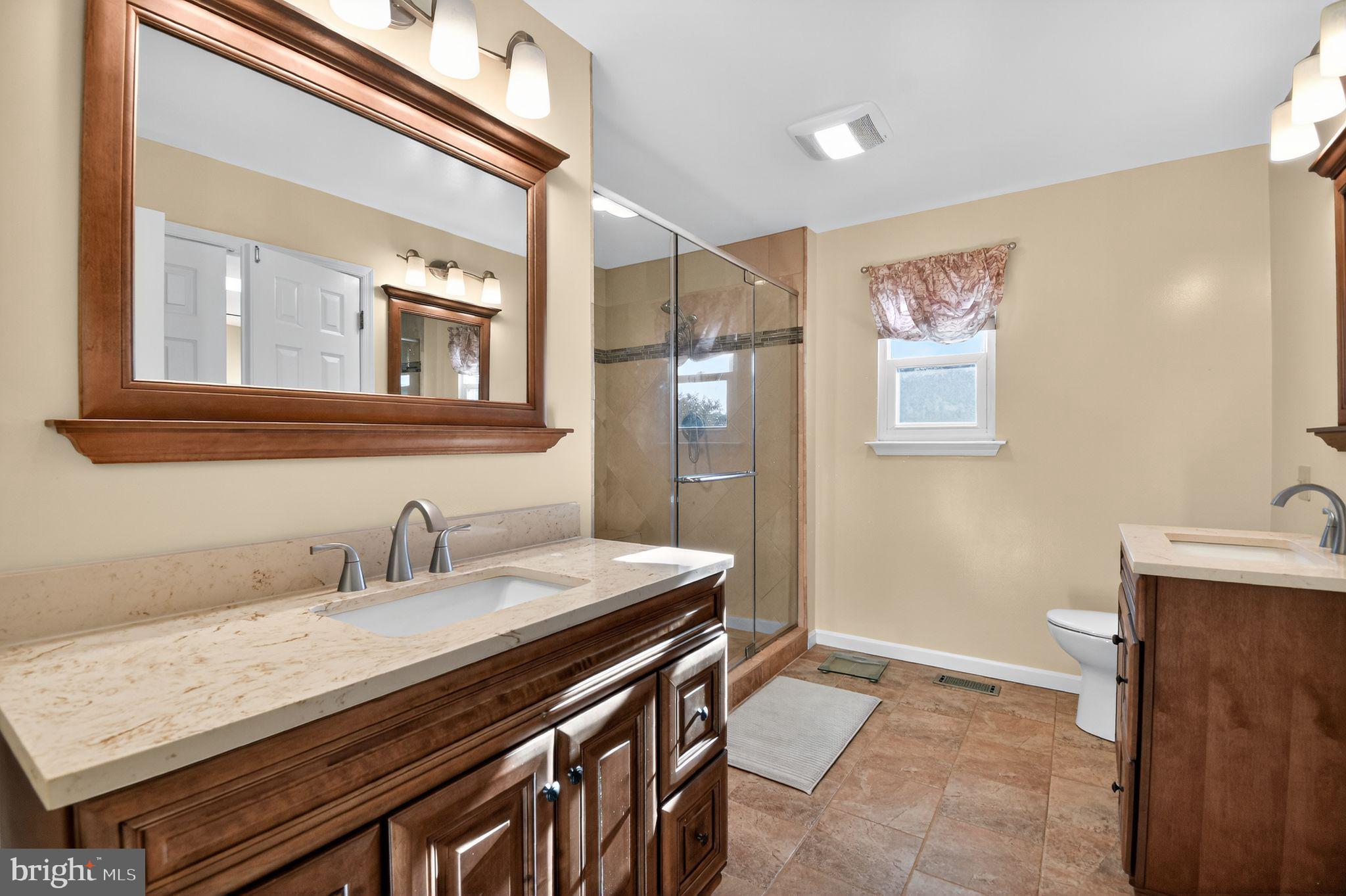 22040 Caravel Court Great Mills, MD 20634 - Photo 8 of 32 a bathroom with a sink and a mirror