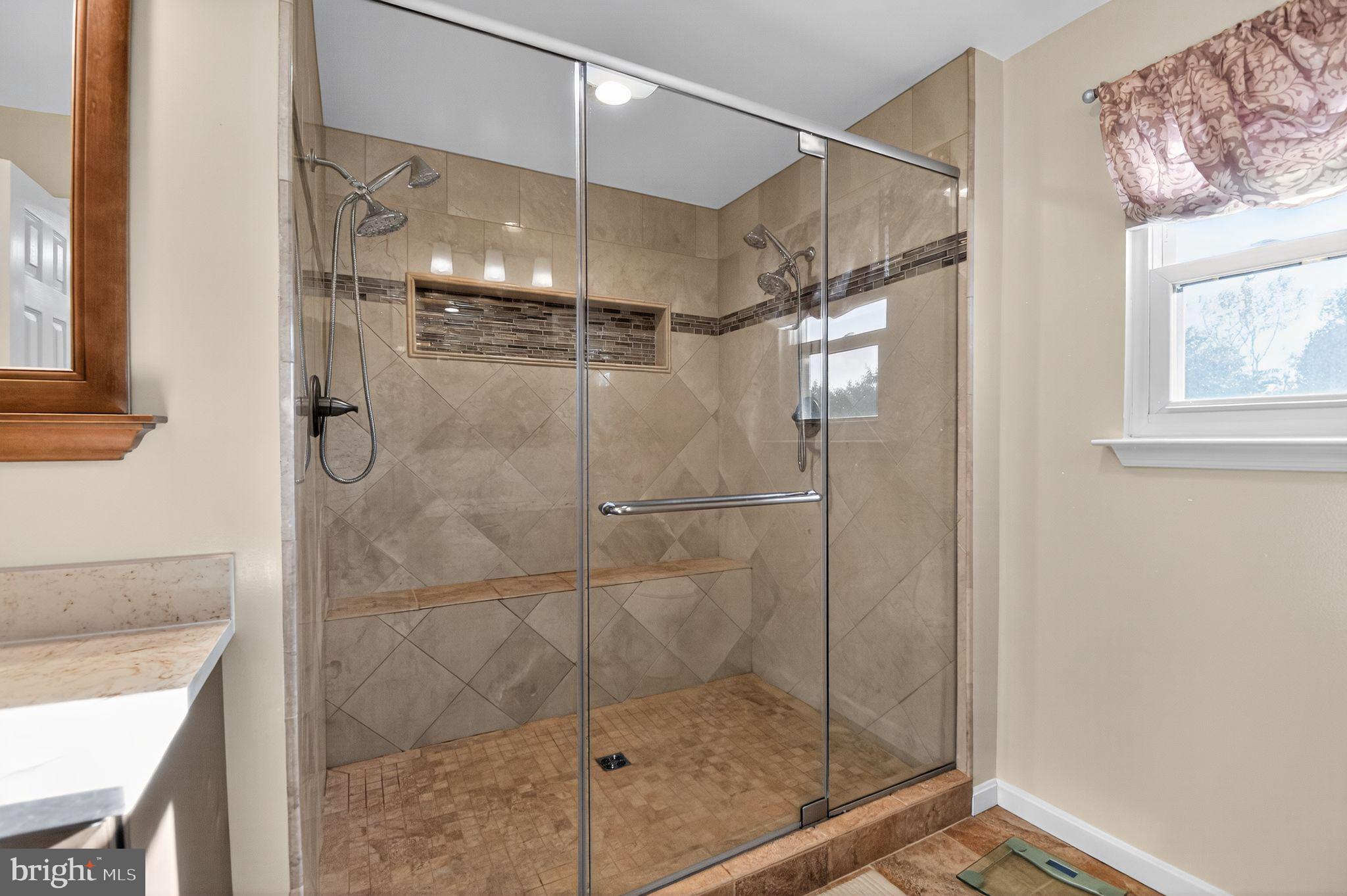 22040 Caravel Court Great Mills, MD 20634 - Photo 9 of 32 a bathroom with a glass shower door