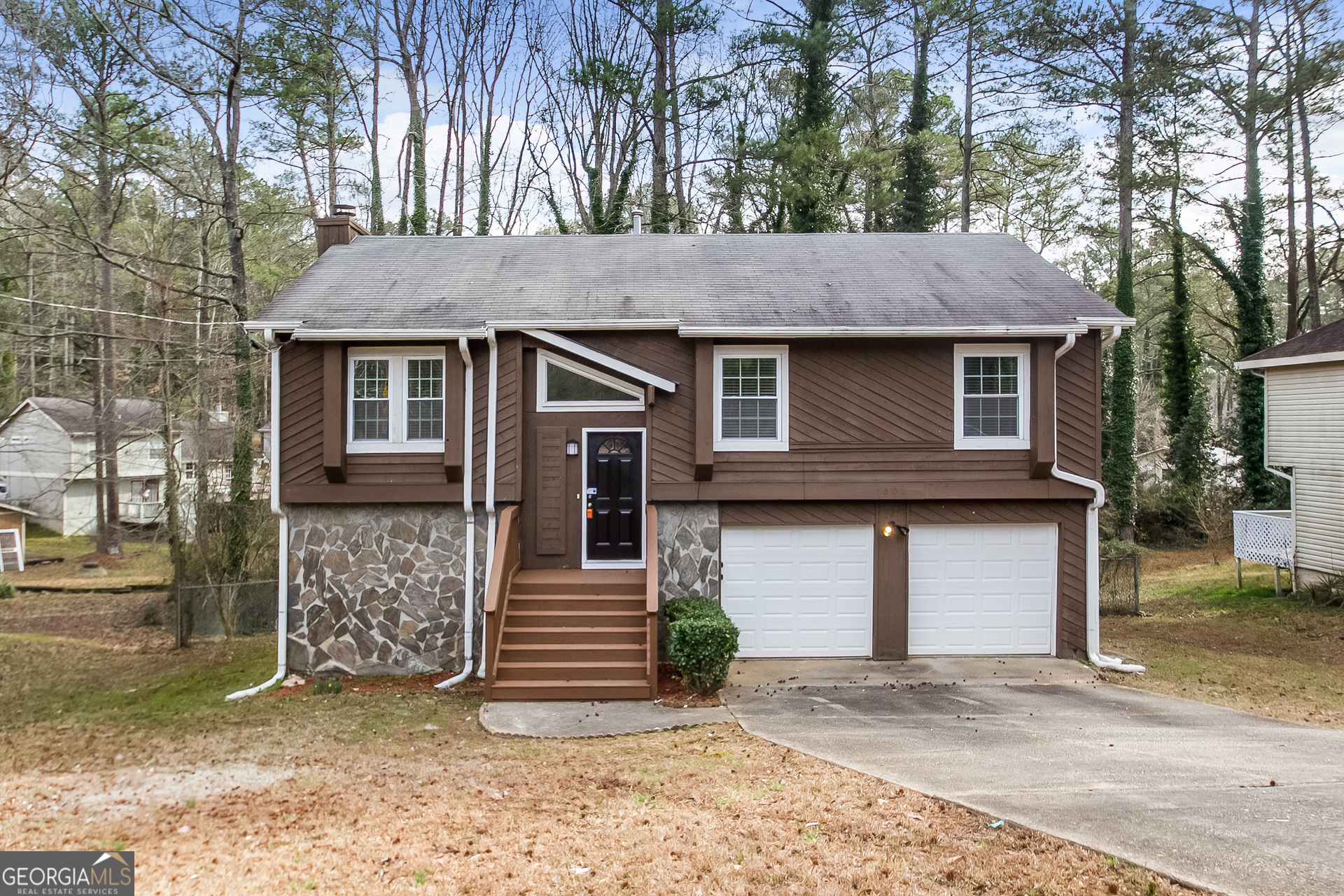 606 Wilson Mill Road Southwest Atlanta, GA 30331 - Photo 1 of 15 a front view of a house with a garage