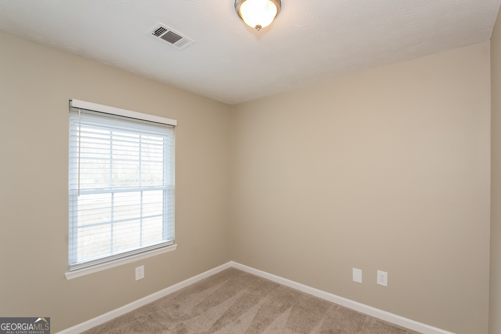 606 Wilson Mill Road Southwest Atlanta, GA 30331 - Photo 11 of 15 an empty room with a window
