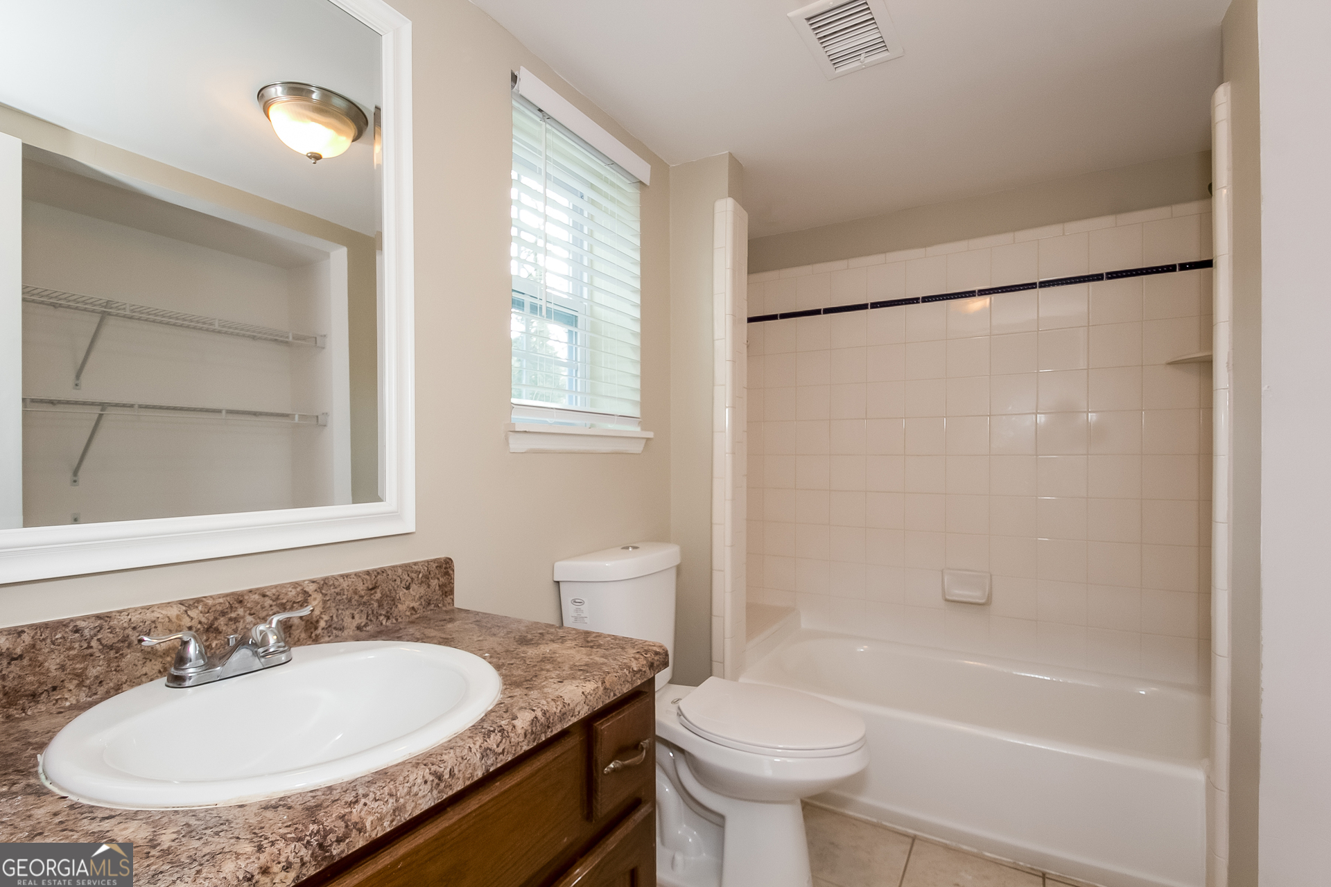 606 Wilson Mill Road Southwest Atlanta, GA 30331 - Photo 13 of 15 a bathroom with a sink toilet and shower