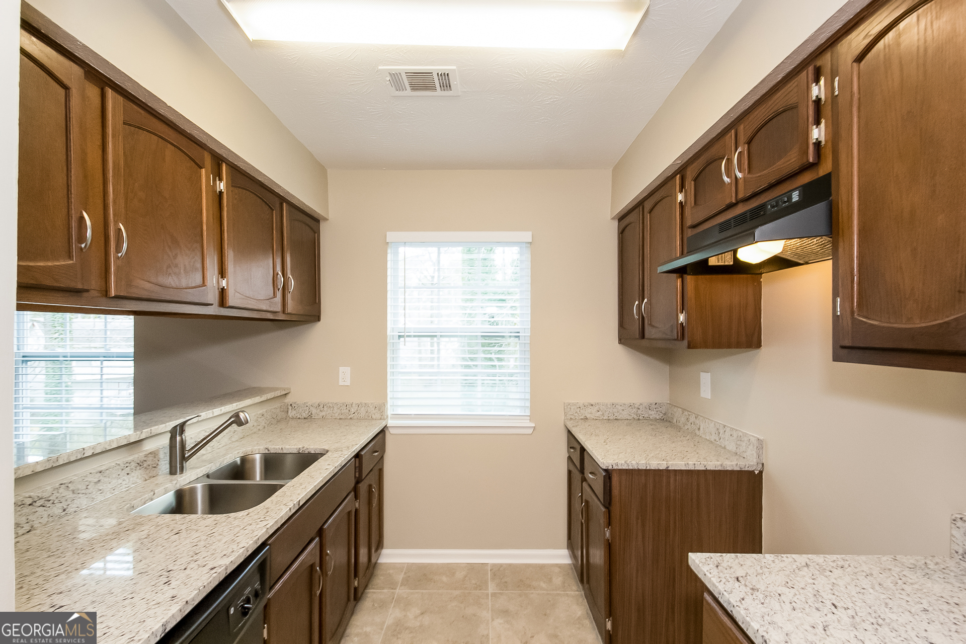 606 Wilson Mill Road Southwest Atlanta, GA 30331 - Photo 5 of 15 a kitchen that has a sink and a stove in it