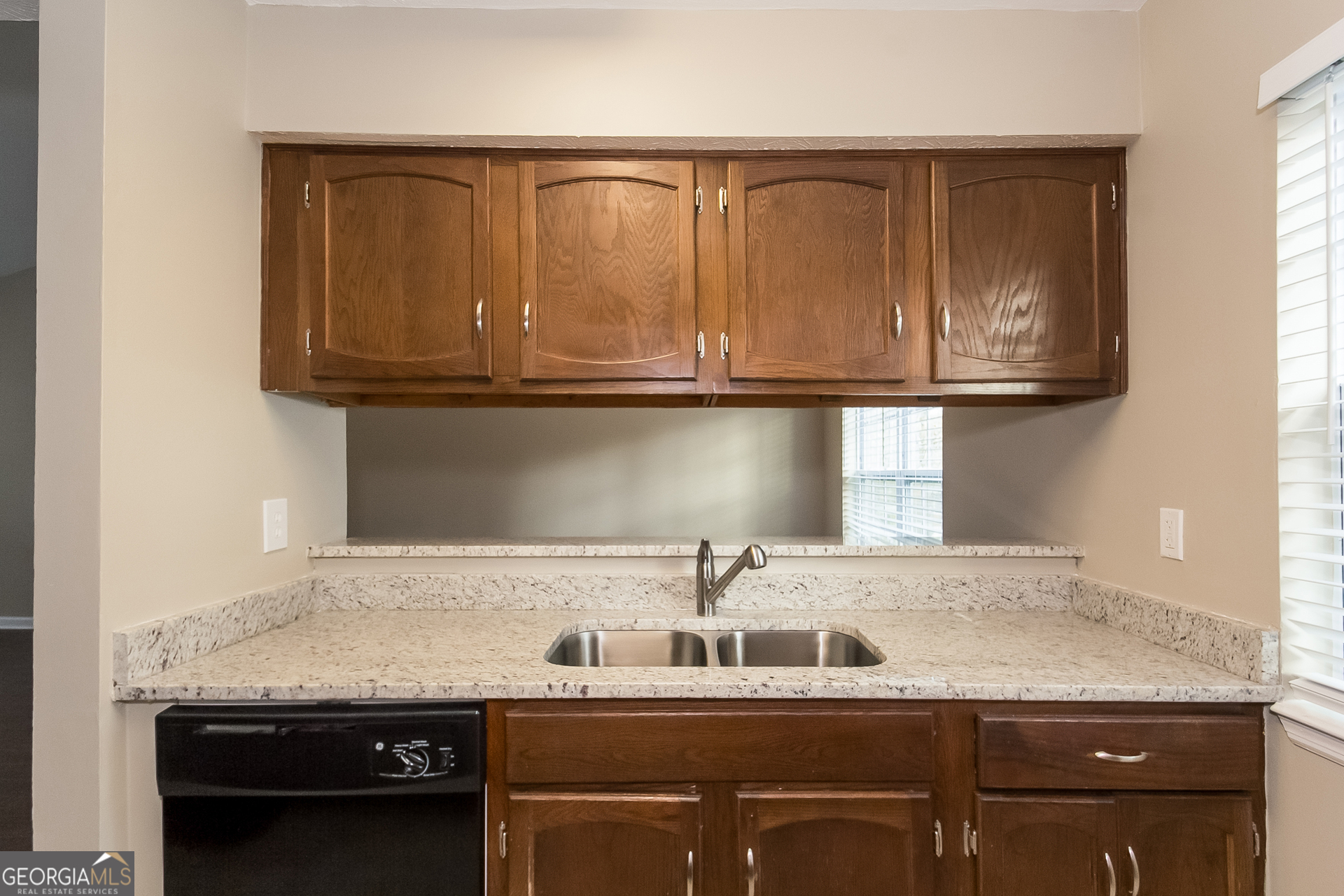 606 Wilson Mill Road Southwest Atlanta, GA 30331 - Photo 6 of 15 a kitchen with a sink and cabinets